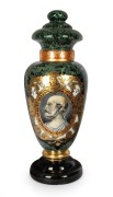 An antique glass apothecary specie jar with reverse painted decoration and green marbled finish, 19th century, 65cm high.