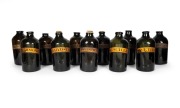 Eleven assorted antique glass apothecary jars, each individually labeled, some with original cork stoppers, late 18th century, the largest 35cm high.