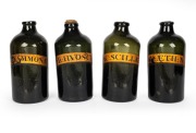 Eleven assorted antique glass apothecary jars, each individually labeled, some with original cork stoppers, late 18th century, the largest 35cm high. - 2
