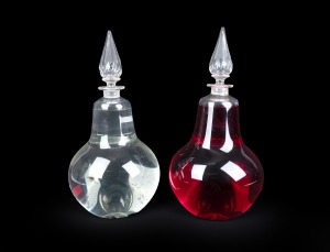 A pair of antique English glass apothecary carboys with facetted stoppers, 19th century, 50cm high.