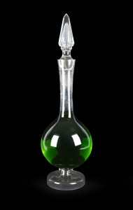 An antique English glass apothecary carboy with facetted stopper, 19th century, 75cm high.