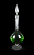 An antique English glass apothecary carboy with facetted stopper, 19th century, 75cm high.