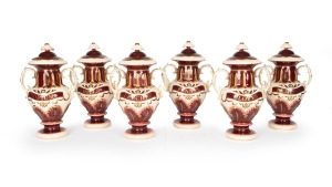 A set of six reproduction porcelain lidded apothecary jars, emblazoned OPIUM, HEMLOCK, FENNEL, CLOVES, DILLS, and LEECHES, 20th century, 40cm high.