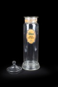 An antique English glass lidded confectionery jar with remains of original paper label "PARKES FRUIT BON-BONS 4D.", 19th/20th century, 55cm high. - 2