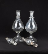 A pair of antique Whitehall Tatum crystal carboys, facetted and thumb cut decoration with unusual double stopper tops, 19th century, A/F, 76cm high. - 2