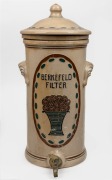 BERKEFELD antique German pottery water filter with coloured floral decoration, early 20th century, 49cm high.