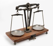 Antique scientific balance scales on timber base, 20th century, 60cm high.