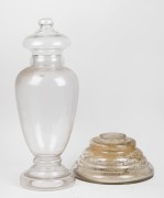 An antique glass apothecary counter top dispensing jar, together with a blank glass apothecary jar, 19th century, (2 items), ​​​​​​​30cm and 76cm high.