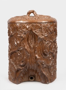 Antique French wall mount pottery water filter with original lid and ornate foliate tree trunk decoration, 19th century, 43cm high.