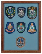 Australian Law Enforcement shoulder patches, displayed in two frames, 20th century, ​​​​​​​44 x 33cm each overall. - 3