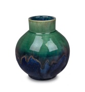 P.P.P. (PREMIER POTTERY, PRESTON) green and blue glazed pottery vase with pink highlights, circular factory mark to base, 16.5cm high.