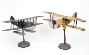 MECCANO two model biplanes on stands, 32cm high, 46cm wingspan.