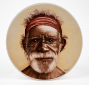 GEORGINA GOULD porcelain plate with hand-painted portrait of an Aboriginal elder, signed lower right, "G. Gould" 28cm diameter.
