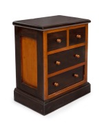 A miniature four drawer kauri pine chest with two tone dark stain finish, 19th/20th century, 35cm high, 29cm wide, 19cm deep.