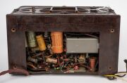 ASTOR MICKEY MOUSE BP brown bakelite Australian mantle radio with pictorial Mickey Mouse glass dial, circa 1937, as is barn find condition, note missing one knob and base plate has been cut with some replacement components. 16cm high. - 5