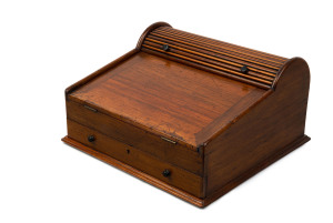 ANDREW LENEHAN (attributed) rare antique Australian cedar lap desk with cedar and kauri tambour compartment and lift-out storage, fall front supported by single drawer beneath revealing fitted interior, Sydney, circa 1850, maker's stamp inside (illegible), 23cm high, 42.5cm wide, 41cm deep.