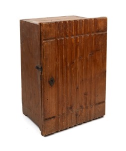 An antique Australian red pine single door cabinet, interior fitted with eighteen graduated drawers, 19th/20th century, ​​​​​​​50cm high, 34cm wide, 26cm deep.