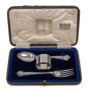 WILLIAM DRUMMOND & Co. of MELBOURNE antique English sterling silver napkin ring, fork and spoon set, housed in original plush fitted retailer's box, early 20th century, the box 20cm wide, 98 grams silver weight.