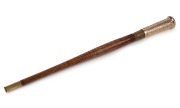 An Australian blackwood baton with 9ct gold handle and bullet casing end, 20th century, 34.5cm high.