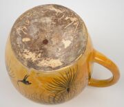 JOHN PERCEVAL & ARTHUR MERRIC BOYD lidded pottery jug on yellow ground, hand-painted with kangaroos and grass trees; together with two coffee cups and three saucers, (6 items), the cups incised "A.M.B. Perceval", the pot incised "Arthur Merric Boyd", the - 4
