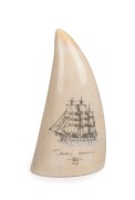 A scrimshaw whale's tooth titled "THE JAMES ARNOLD, 1852", by GARY TONKIN, ​​​​​​​11cm high.