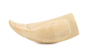 A scrimshaw sperm whale tooth with carved whale decoration, from the Eden Whaling Station, South Coast of New South Wales, 13cm high.