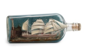 A vintage ship in a bottle, 20th century, 25cm long.