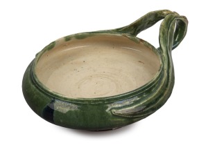 MARGUERITE MAHOOD green and brown glazed pottery bowl with applied gum leaf decoration, incised "M. Mahood" with artist's monogram, 7.5cm high, 19cm wide.