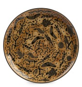 CARL COOPER pottery plate with hand-painted sgraffito Aboriginal decoration, incised "Carl Cooper, Australia, 1950", ​​​​​​​22.5cm diameter.