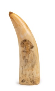 A scrimshaw whale's tooth with male portrait, 12cm high.