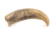 A scrimshaw whale's tooth titled "VIVA ELEVALA, GOOD ENOUGH, 1939", 12.5cm long.
