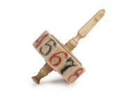 An antique carved whalebone gaming top, 18th/19th century, ​​​​​​​6cm high. - 2