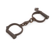 Convict era handcuffs with screw key, 19th century, ​​​​​​​24cm wide.