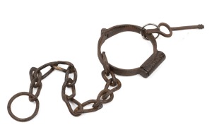 A convict "Plug" leg iron with chain and original key, 19th century, 43cm long overall.