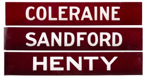Three antique railway platform signs in etched ruby glass for gasolier illumination.