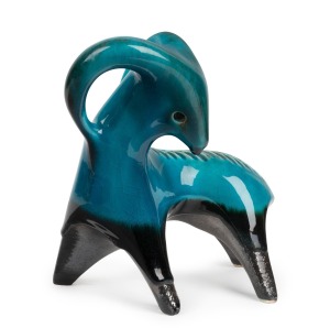ELLIS turquoise glazed pottery ram statue; together with a 1961 Australian Home Journal magazine featuring Ellis pottery, (2 items), the ram 21cm high, 20cm long.