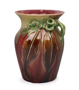 REMUED pottery vase with applied gumnuts, leaves and branch handle, glazed in striking pink and green with unusual brown glazed leaves, incised "Remued, Hand Made, 196/7M", 19cm high.