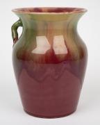 REMUED pottery vase with applied gumnuts, leaves and branch handle, glazed in striking pink and green with unusual brown glazed leaves, incised "Remued, Hand Made, 196/7M", 19cm high. - 2