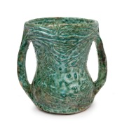 MERRIC BOYD two handled pottery vase with landscape and windswept tree decoration finished in an unusual experimental green glaze, incised "Merric Boyd Gum Tree, Australia", ​​​​​​​20cm high, 20cm wide.
