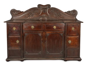 An early Colonial Australian cedar sideboard with ornately carved scrolling back adorned with birds and grapes, New Norfolk, Tasmanian origin, circa 1820, purported to have come from the Metzger Family. 144cm high, 190cm wide, 57cm deep.