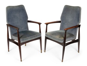 A pair of stained and polished teak armchairs, upholstered in blue velvet, possibly designed by FRED LOWEN for Australian furniture company FLER, mid 20th century, 59cm across the arms. Note: These were executive boardroom chairs from the G.J. Coles head office in Melbourne.
