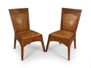WALTER BURLEY GRIFFIN "Straight Chair" pair, manufactured in oak and leather by JAMES MOORE & SONS Pty Ltd. Melbourne, for Newman College, University of Melbourne, circa 1917, 90cm high.