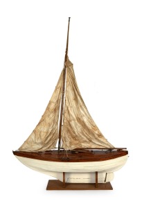 An impressive scratch-built model yacht on stand with brass name plaque affixed to the deck "SKIMPIE", 196cm high, 136cm long.