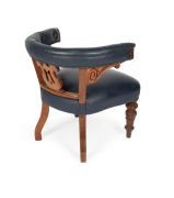 An antique Australian cedar and blue button back leather upholstered tub chair with carved acanthus decoration, Melbourne origin, 19th century, 76cm high, 71cm across the arms. Note: Purported to have been part of the furnishings from the Melbourne Supre - 2