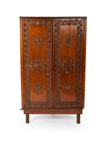 An antique chip carved kauri pine two door corner cabinet, early 20th century, 107cm high, 63cm wide, 32cm deep.