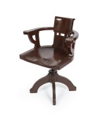 STATE LIBRARY OF VICTORIA antique silky oak revolving armchair from the famed reading room, 19th century, with later brown painted finish, 62cm across the arms.