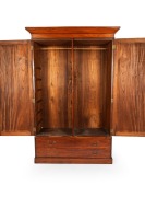 A Colonial Australian cedar two door wardrobe with two long drawers to the base, interior fitted with hanging space on one side and shelving on the other, New South Wales origin, circa 1860, 207cm high, 136cm wide, 56cm deep. - 2