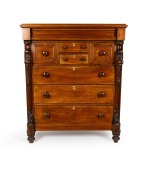 An antique Australian cedar eight drawer chest with full length carved corbels, red pine secondary timbers, Melbourne origin, circa 1880, ​​​​​​​146cm high, 122cm wide, 58cm deep.