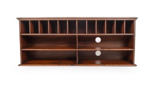 An Australian cedar desk top pigeonhole tidy, 19th century, 52cm high, 125cm wide, 32cm deep.