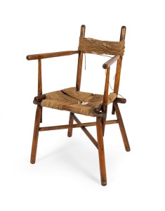 An antique Australian blackwood armchair with remains of rush seat and back, unknown origin, 19th century, 52cm across the arms.